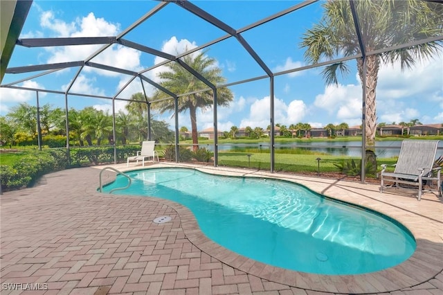 view of pool with a patio area, a water view, and glass enclosure