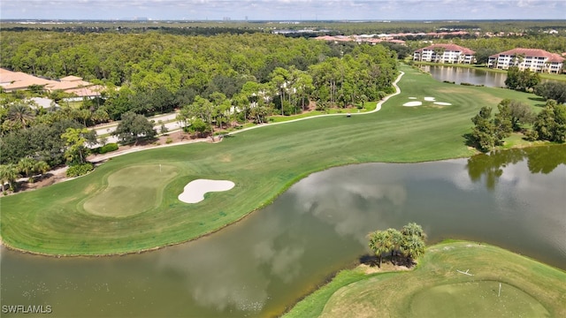 bird's eye view featuring view of golf course and a water view