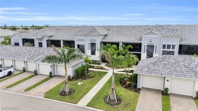 view of front facade with a front yard and a garage