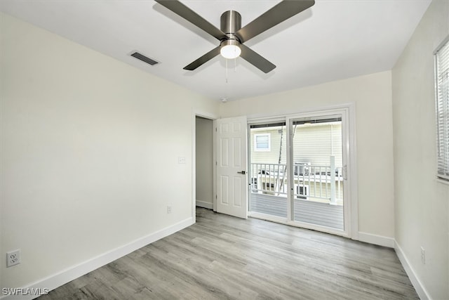 spare room featuring ceiling fan and light hardwood / wood-style floors