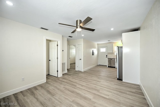 unfurnished living room featuring light hardwood / wood-style flooring and ceiling fan