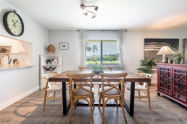 dining space featuring dark hardwood / wood-style flooring