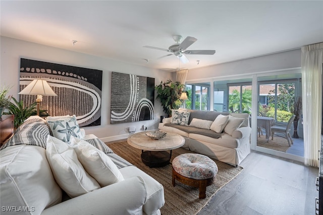 living room with hardwood / wood-style floors and ceiling fan