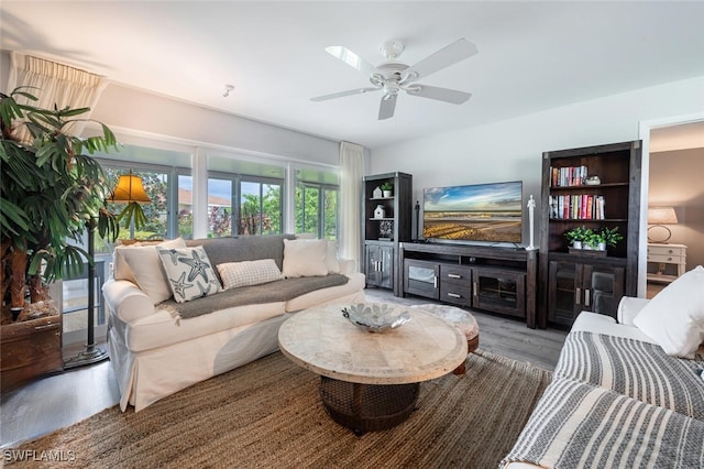 living room with ceiling fan and light hardwood / wood-style floors