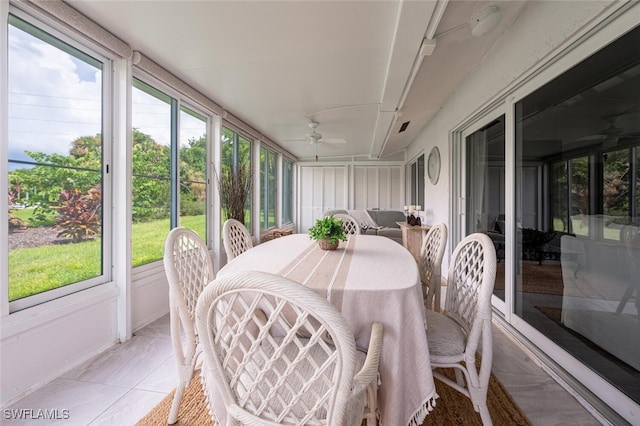 sunroom / solarium featuring ceiling fan and a wealth of natural light