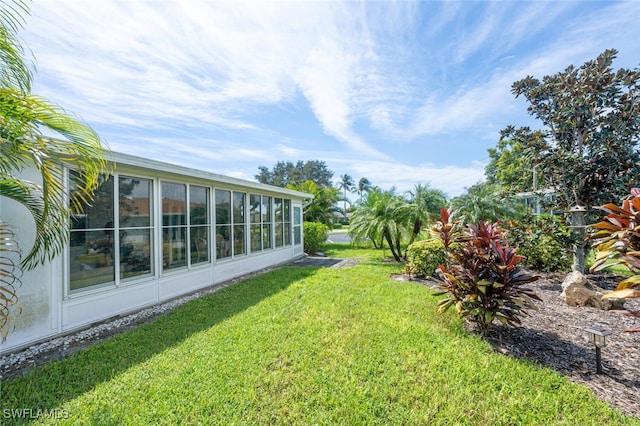 view of yard with a sunroom