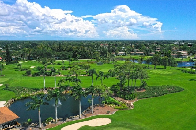 bird's eye view featuring golf course view and a water view