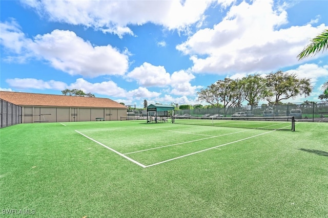 view of sport court with fence