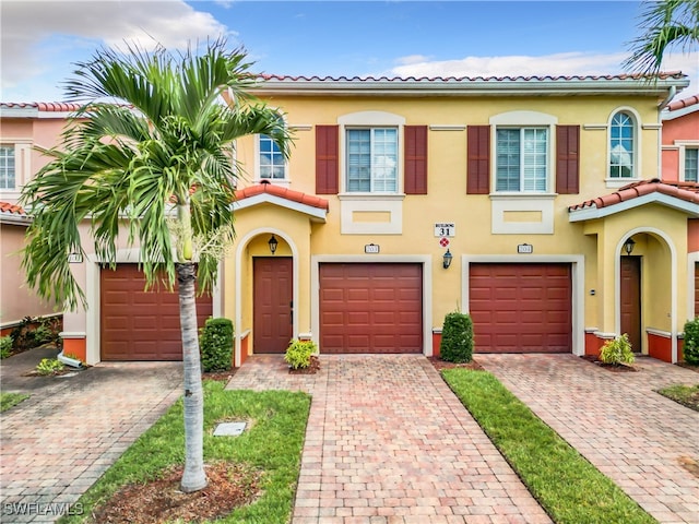 mediterranean / spanish-style house featuring a garage