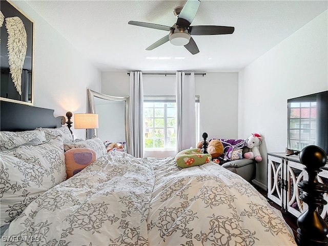 bedroom featuring hardwood / wood-style flooring and ceiling fan