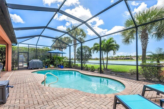 view of swimming pool featuring a water view, grilling area, a lanai, and a patio