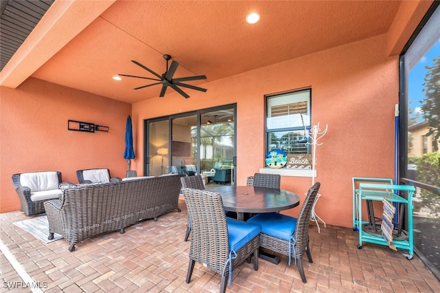 view of patio / terrace with ceiling fan and outdoor lounge area