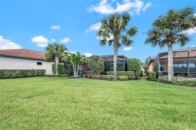 view of yard with a lanai