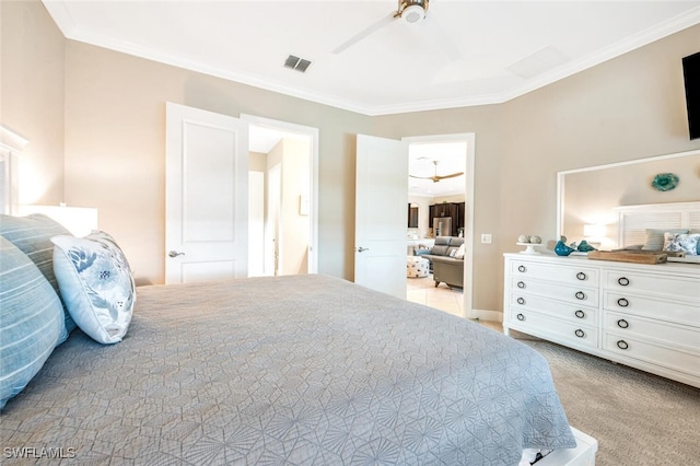 bedroom featuring ornamental molding, light colored carpet, and ceiling fan