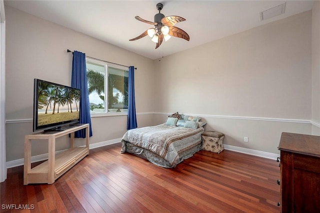 bedroom featuring hardwood / wood-style flooring and ceiling fan