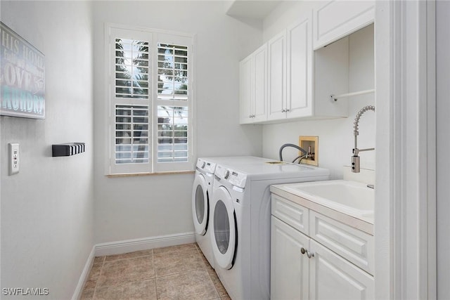 laundry area featuring cabinets, washing machine and dryer, sink, and light tile patterned flooring