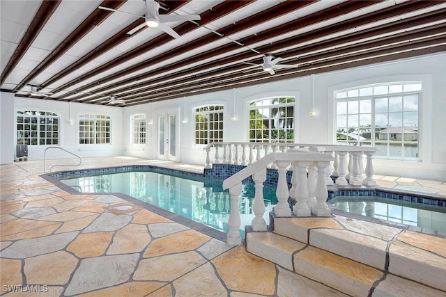 view of swimming pool featuring ceiling fan