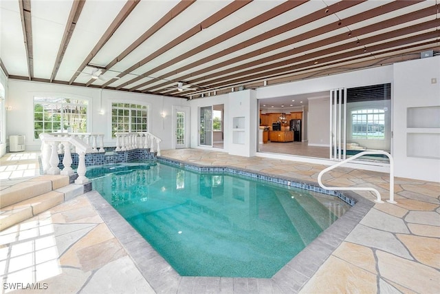 view of pool featuring a jacuzzi and ceiling fan