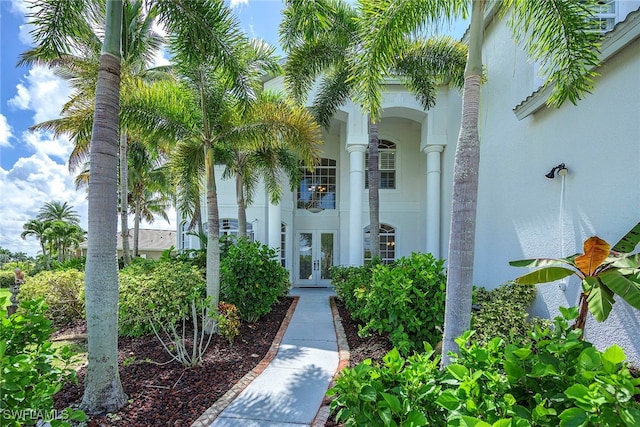 view of exterior entry featuring french doors