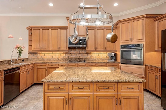 kitchen featuring tasteful backsplash, ornamental molding, a kitchen island, a sink, and black appliances