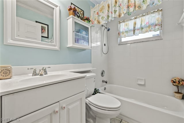 full bathroom featuring tiled shower / bath, toilet, and vanity