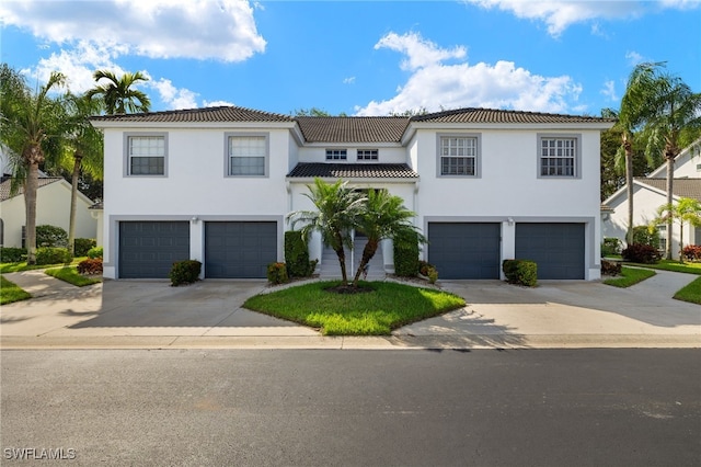 mediterranean / spanish-style home featuring a garage