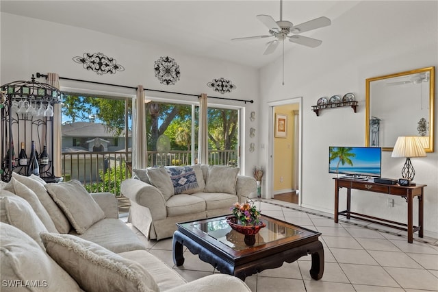 living room with ceiling fan and light tile patterned flooring