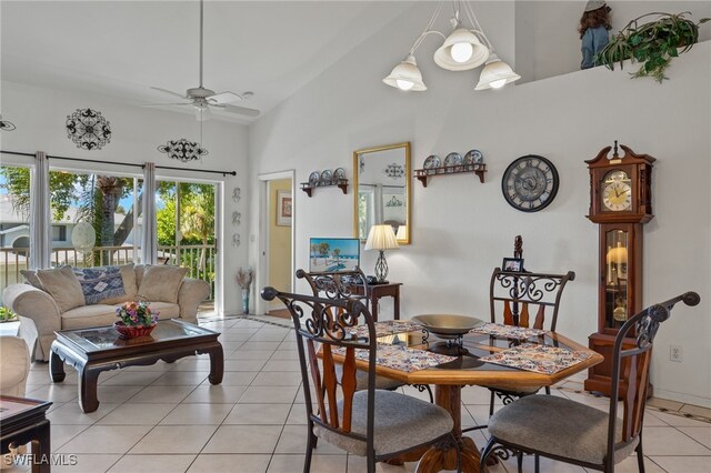 tiled dining space with vaulted ceiling and ceiling fan