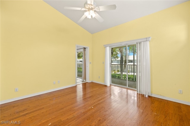 1010 Partridge Cir Unit 202, Naples, FL 34104 - empty room with wood finished floors, high vaulted ceiling, baseboards, and a ceiling fan