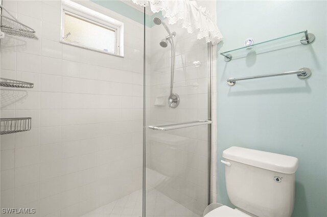 1010 Partridge Cir Unit 202, Naples, FL 34104 - full bathroom with a shower stall and toilet
