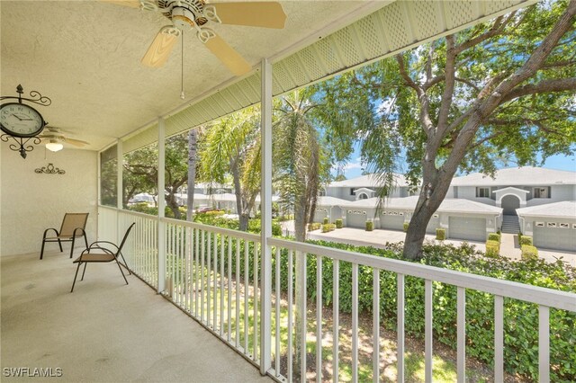 1010 Partridge Cir Unit 202, Naples, FL 34104 - unfurnished sunroom featuring ceiling fan and a residential view
