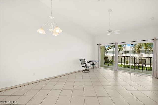 1010 Partridge Cir Unit 202, Naples, FL 34104 - unfurnished room with a chandelier, ceiling fan, high vaulted ceiling, and light tile patterned floors