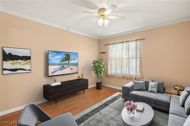 1010 Partridge Cir Unit 202, Naples, FL 34104 - living room with wood finished floors, ornamental molding, a ceiling fan, and baseboards