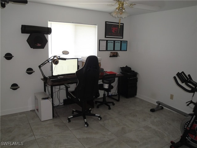 tiled office featuring ceiling fan