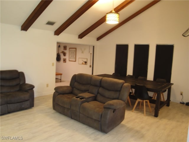 living room with light hardwood / wood-style floors and lofted ceiling with beams