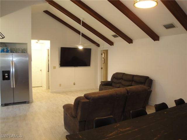 living room featuring beamed ceiling, high vaulted ceiling, and light colored carpet