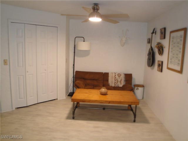 sitting room with ceiling fan and light hardwood / wood-style floors