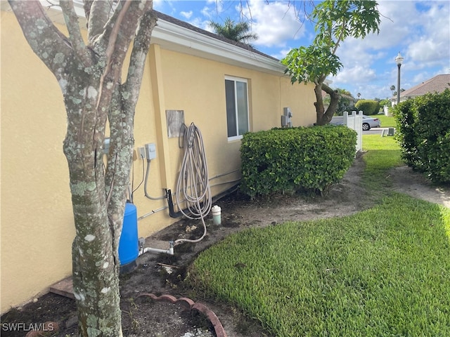 view of home's exterior featuring a yard