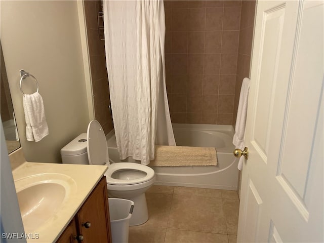 full bathroom with vanity, toilet, shower / tub combo with curtain, and tile patterned floors