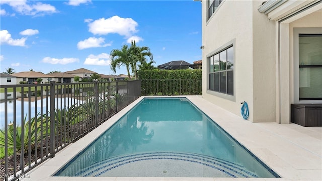 view of pool with a water view