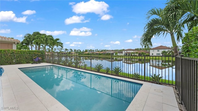 view of swimming pool with a water view