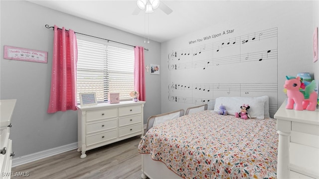 bedroom with ceiling fan and light wood-type flooring