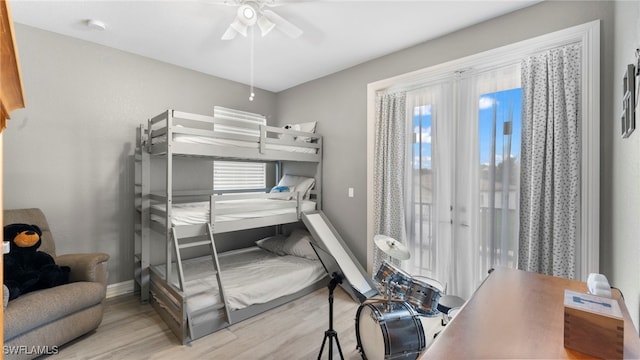 bedroom with light wood-type flooring and ceiling fan