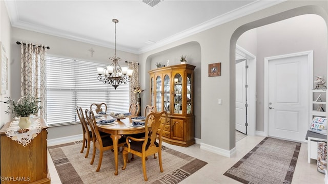 dining area with plenty of natural light, an inviting chandelier, light tile patterned flooring, and ornamental molding