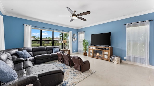 living room with ornamental molding and ceiling fan