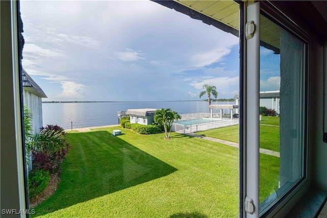 view of yard featuring a balcony and a water view