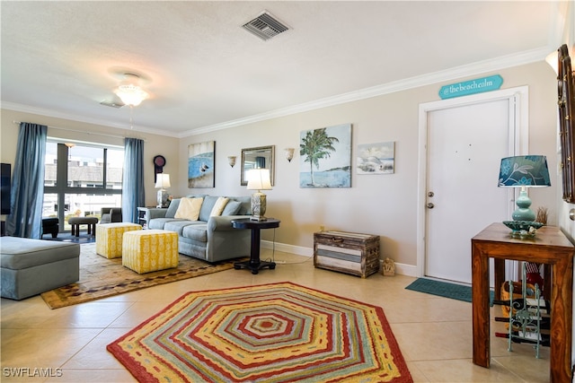 living room featuring crown molding, light tile patterned floors, and ceiling fan