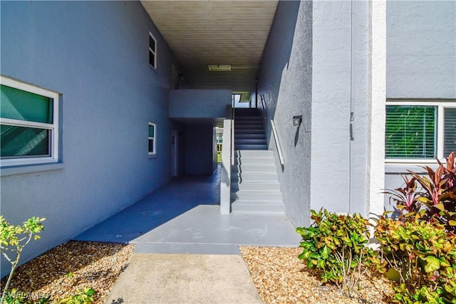 property entrance featuring stucco siding