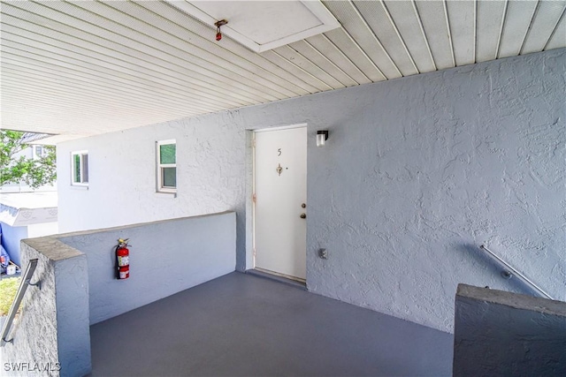 entrance to property with stucco siding