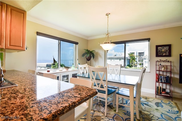 dining room featuring crown molding